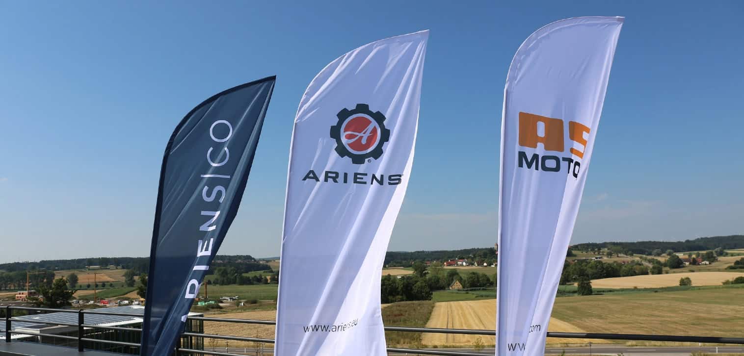 AriensCo EMEAA: Close up of flags of: AriensCo, Ariens and AS-Motor
